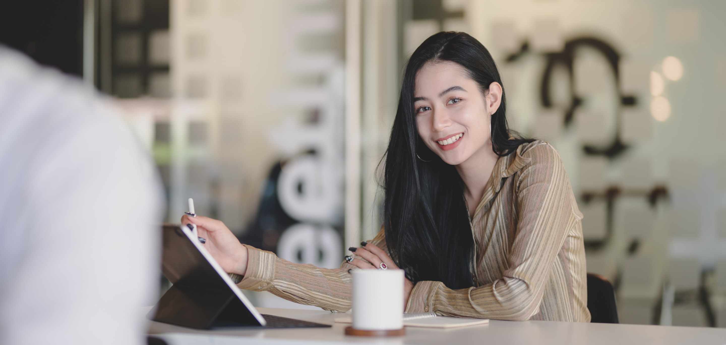 Woman in Brown Leather Jacket Holding White Tablet Computer